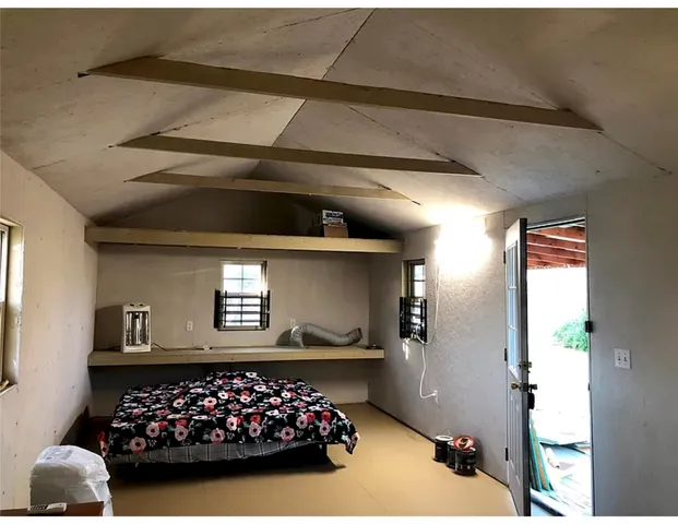 a kitchen with white cabinets and a sink