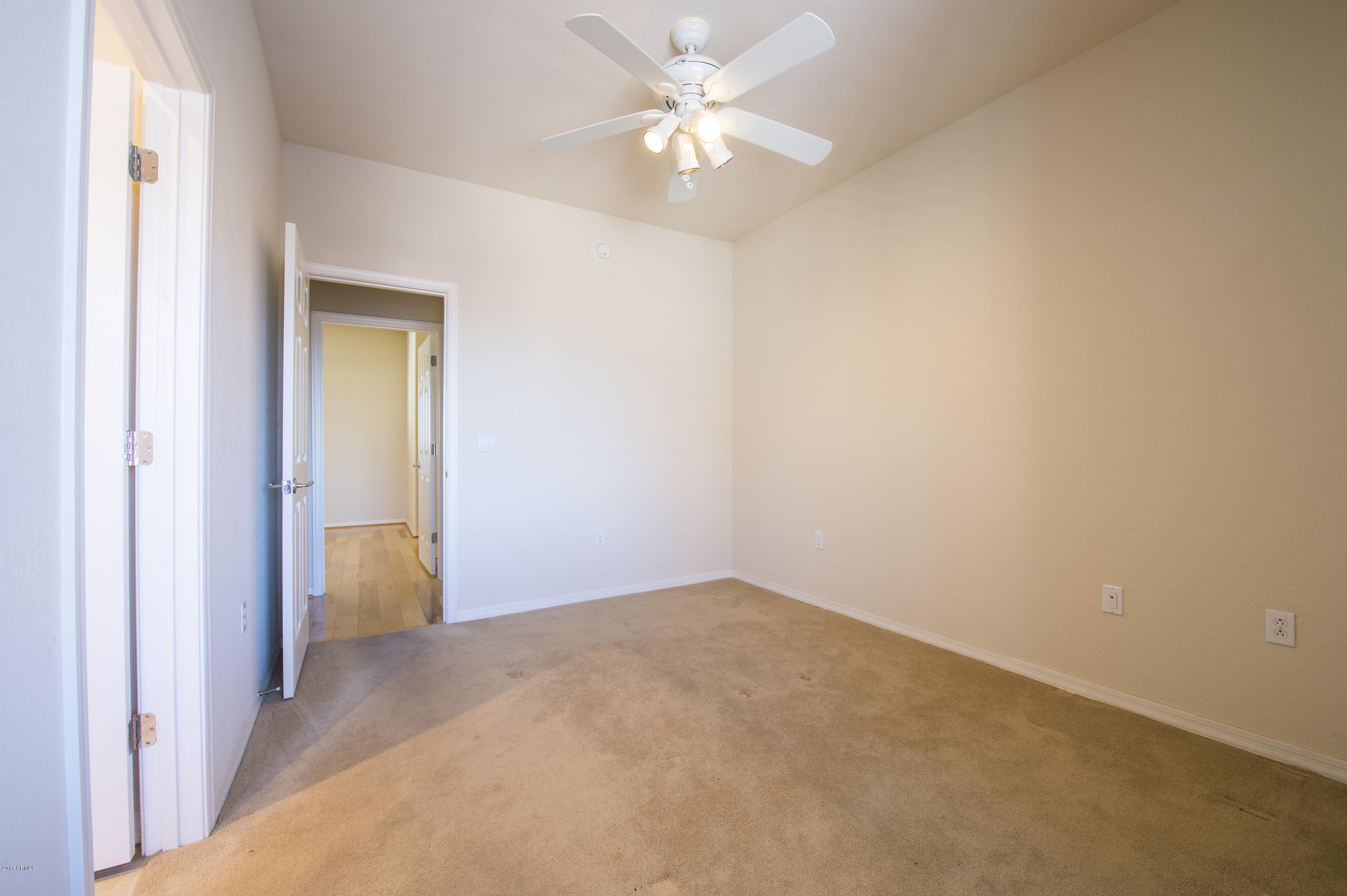3935 East Rough Rider Road, Unit 1195 Phoenix, AZ 85050 - Photo 32 of 35 Bedroom 2 looking towards Master