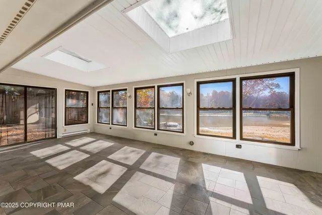 a bathroom with a bathtub and shower