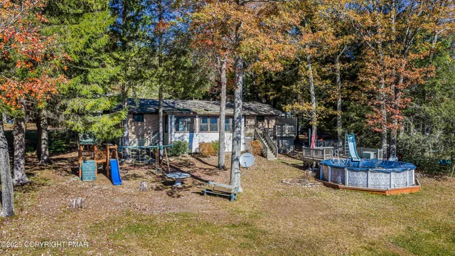 a view of a balcony with floor to ceiling windows and wooden floor