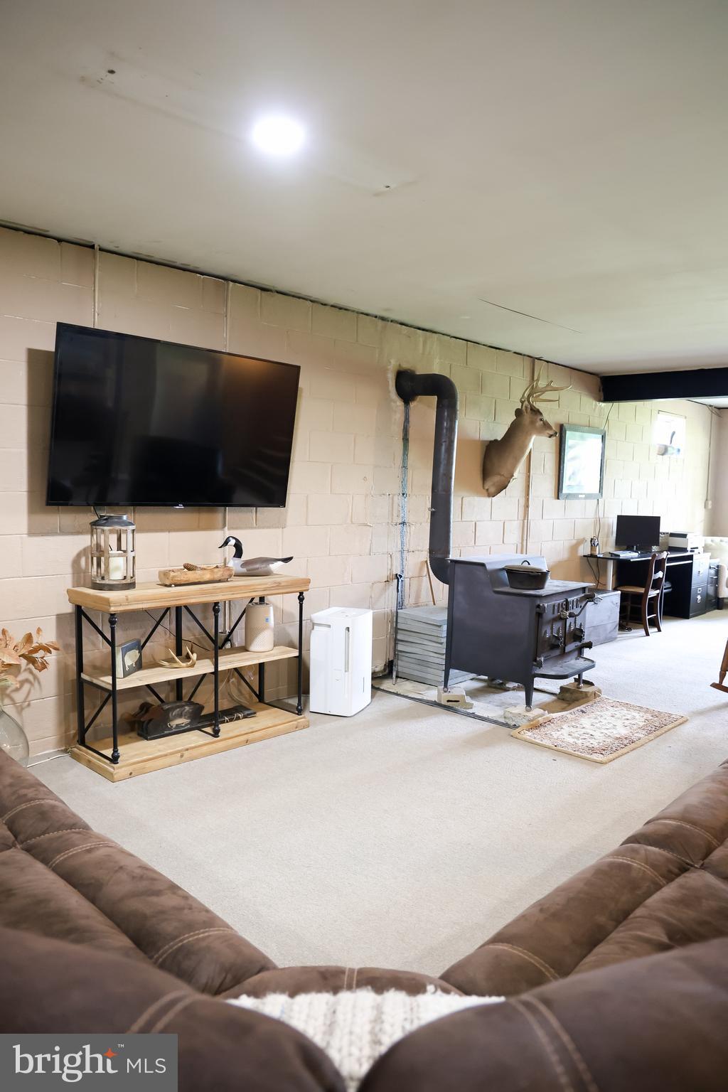 2353 Shuresville Road Darlington, MD 21034 - Photo 20 of 25 a living room with furniture and a flat screen tv