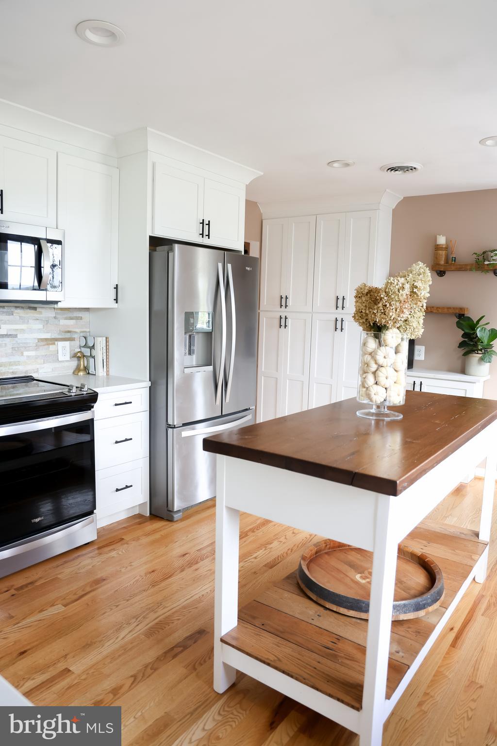 2353 Shuresville Road Darlington, MD 21034 - Photo 7 of 25 a kitchen with stainless steel appliances granite countertop a refrigerator and a stove top oven
