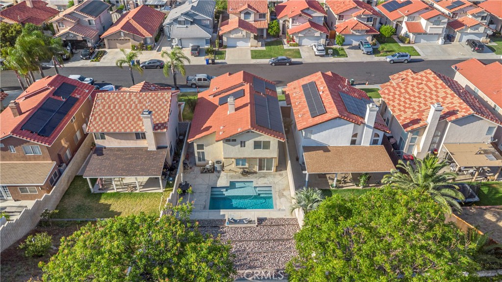 15417 Tobarra Road Fontana, CA 92337 - Photo 29 of 29 an aerial view of residential houses with outdoor space and swimming pool