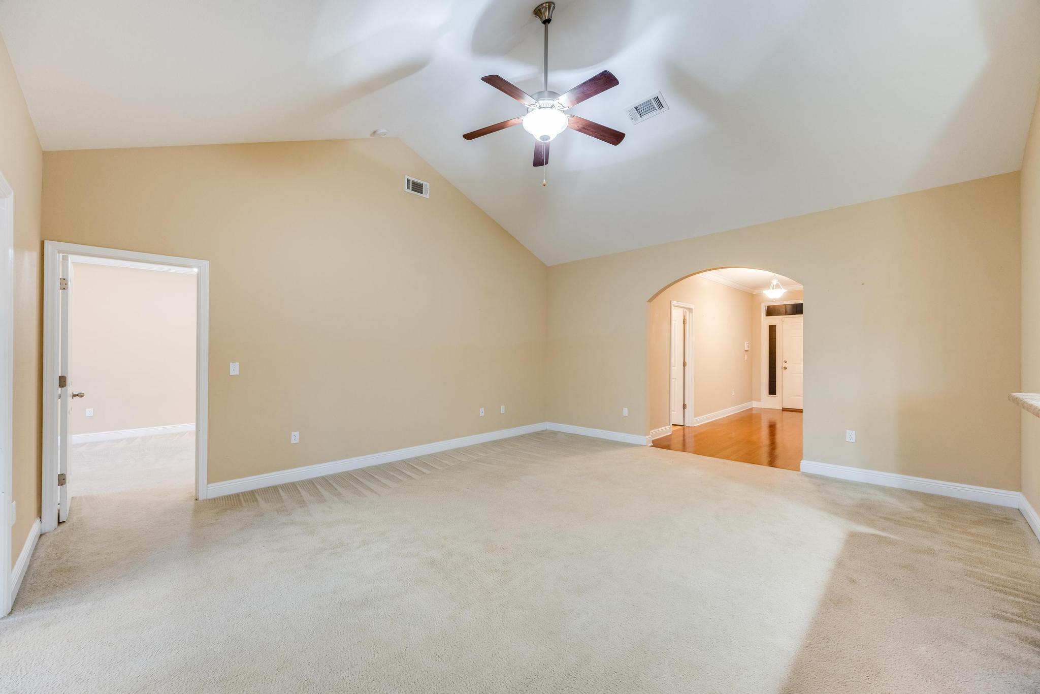 750 Lime Lane Crestview, FL 32536 - Photo 11 of 51 an empty room with ceiling fan and window