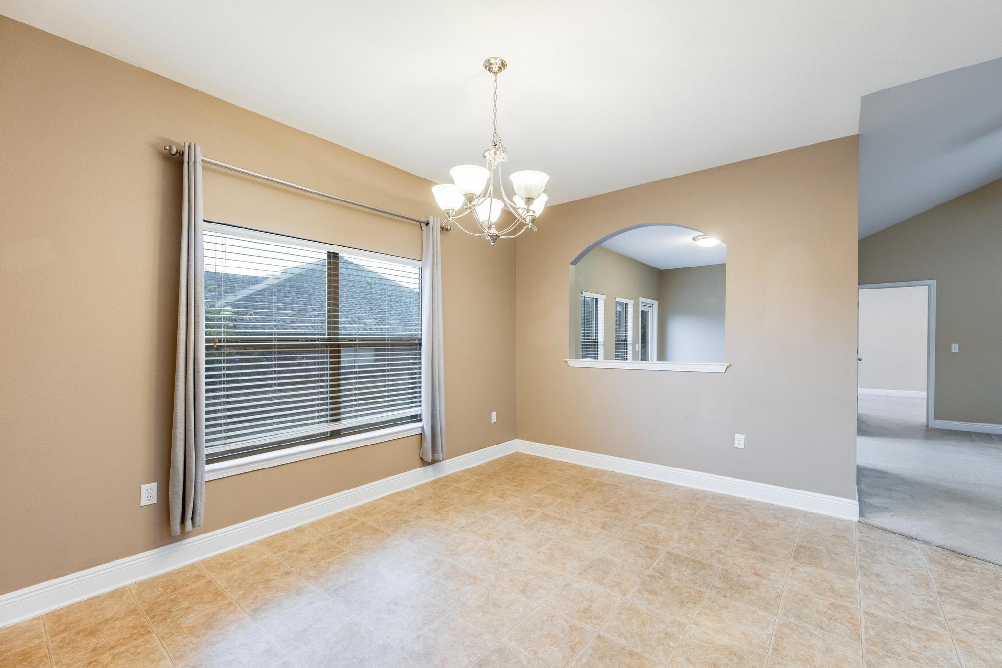 750 Lime Lane Crestview, FL 32536 - Photo 14 of 51 a view of a livingroom with a chandelier fan and windows