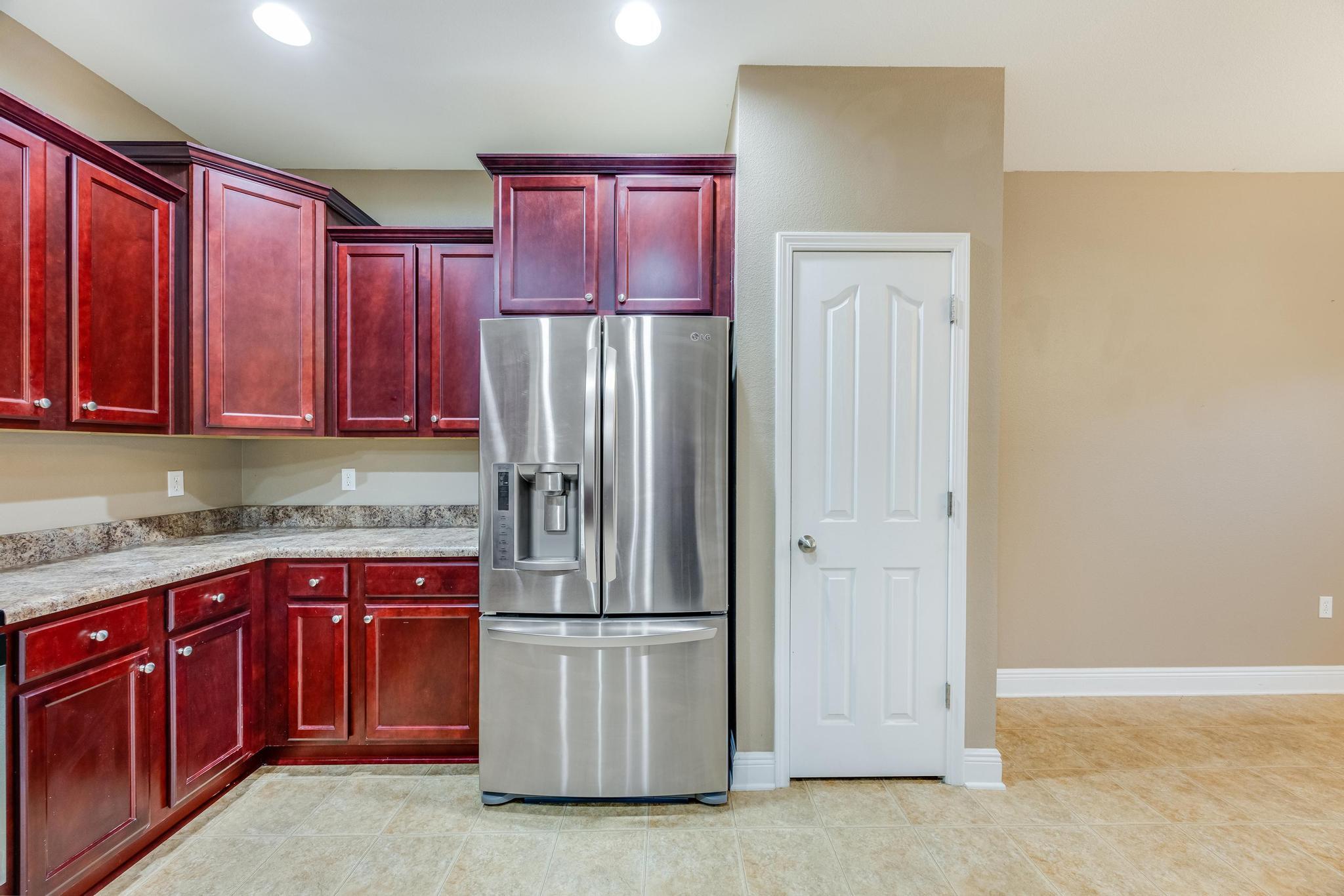 750 Lime Lane Crestview, FL 32536 - Photo 18 of 51 a kitchen with a refrigerator sink and cabinets