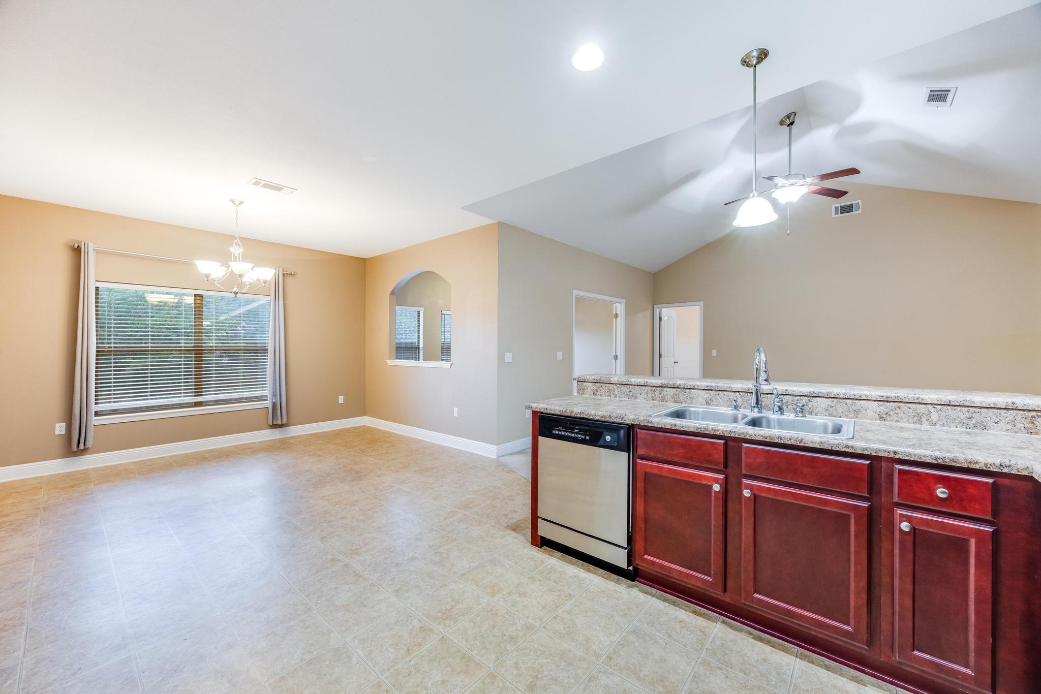 750 Lime Lane Crestview, FL 32536 - Photo 20 of 51 a view of a kitchen with a sink and chandelier fan