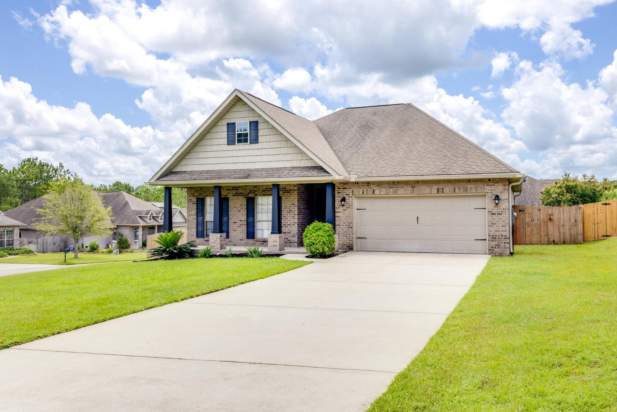 750 Lime Lane Crestview, FL 32536 - Photo 2 of 51 a front view of a house with a yard and garage