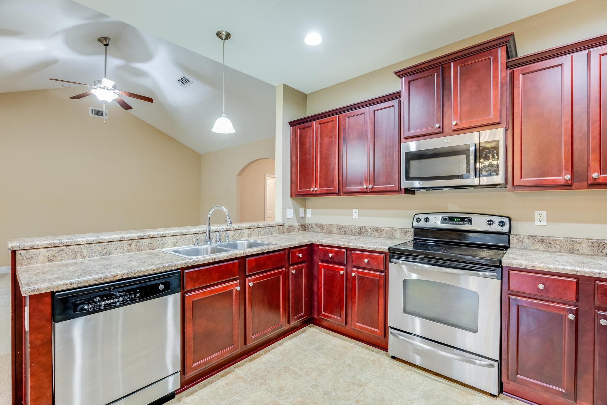 750 Lime Lane Crestview, FL 32536 - Photo 22 of 51 a kitchen with a sink stove and microwave