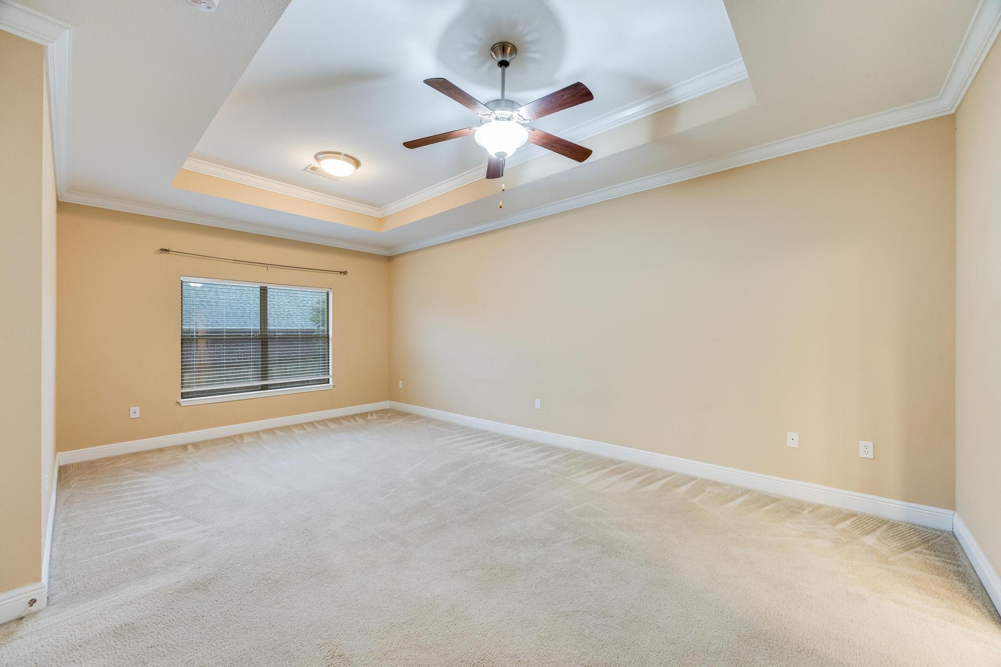 750 Lime Lane Crestview, FL 32536 - Photo 24 of 51 an empty room with chandelier fan and windows