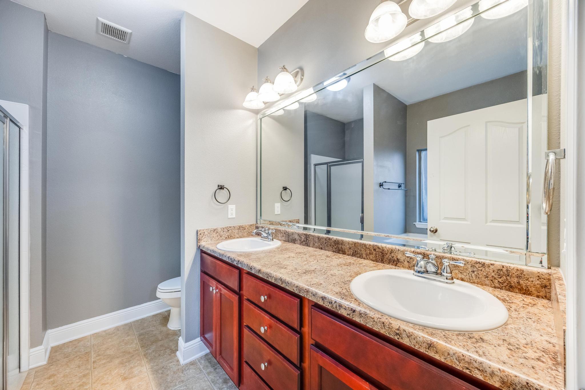 750 Lime Lane Crestview, FL 32536 - Photo 27 of 51 a bathroom with a granite countertop double vanity sink and a mirror