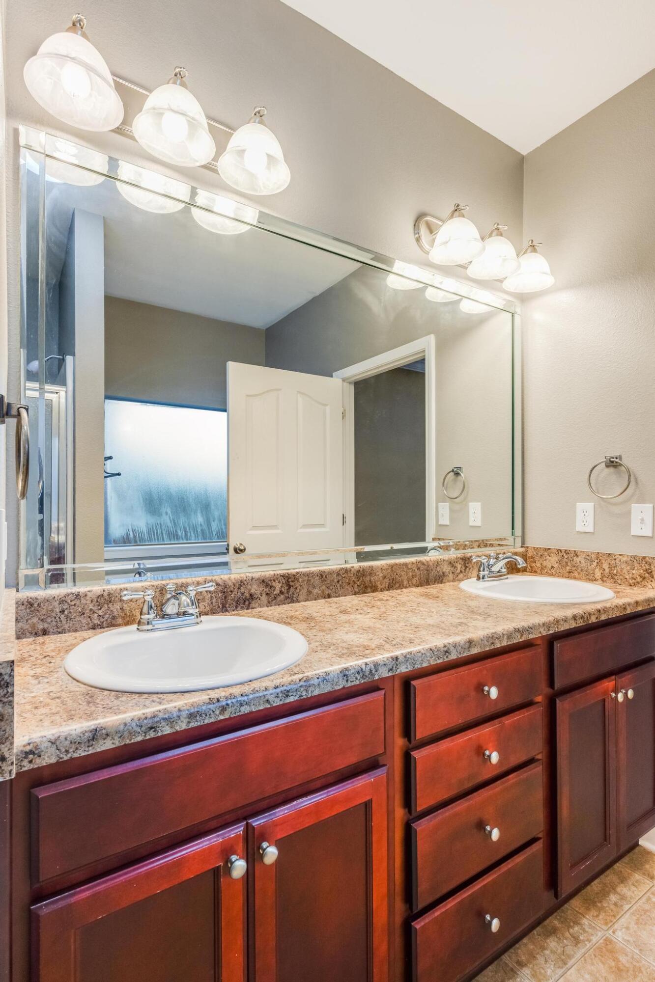 750 Lime Lane Crestview, FL 32536 - Photo 28 of 51 a bathroom with a granite countertop sink and a mirror