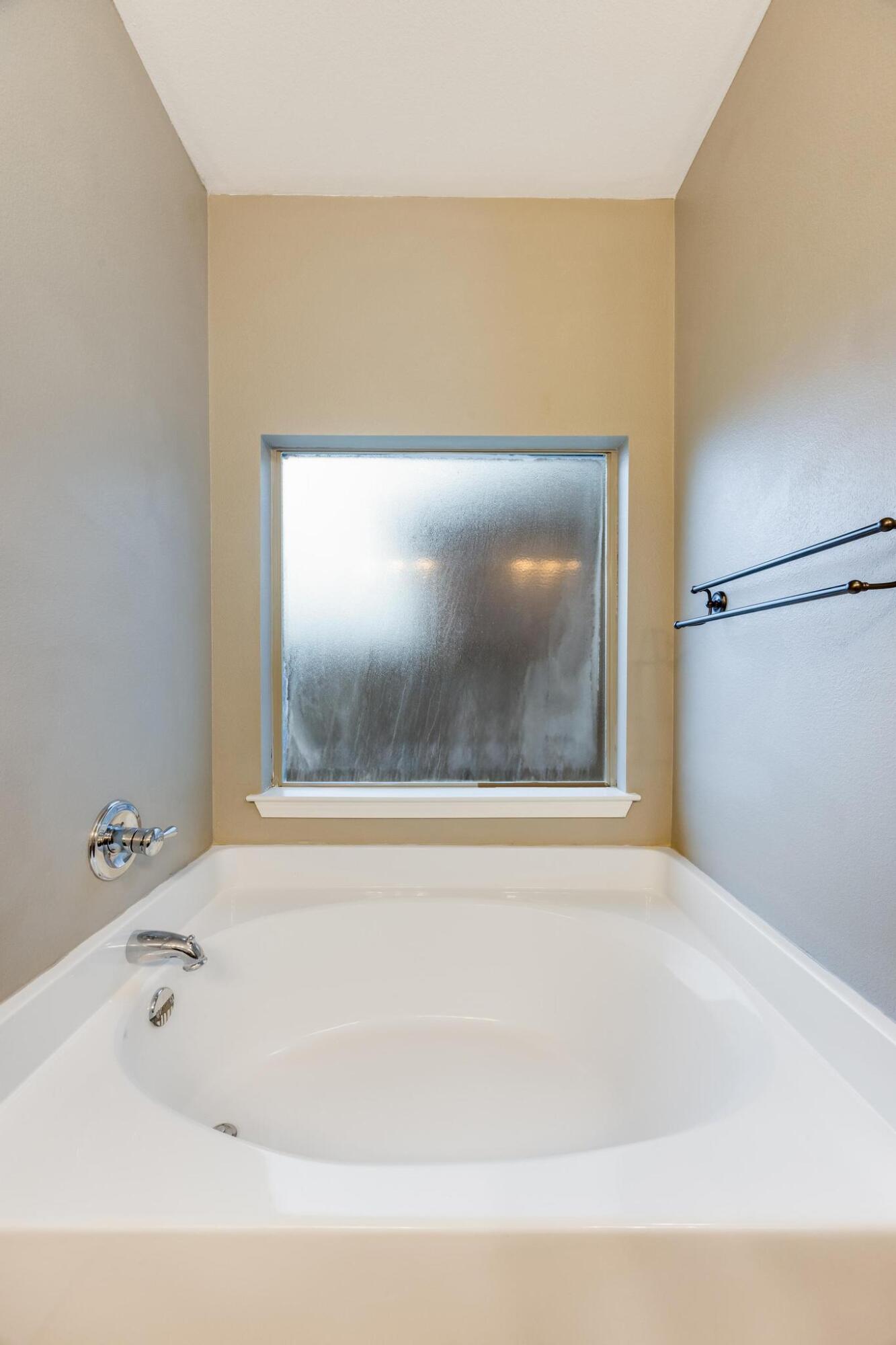 750 Lime Lane Crestview, FL 32536 - Photo 29 of 51 a bathroom with a bathtub and a shower