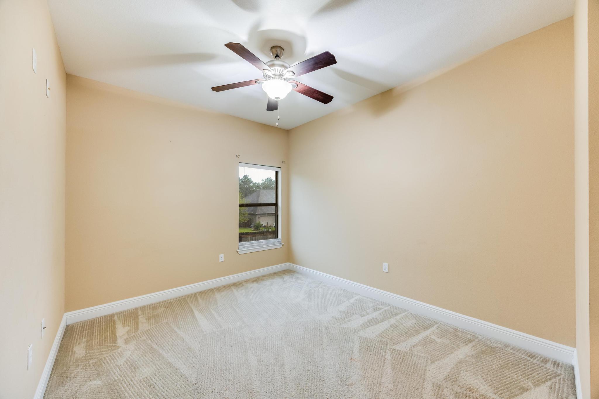 750 Lime Lane Crestview, FL 32536 - Photo 34 of 51 an empty room with windows and fan
