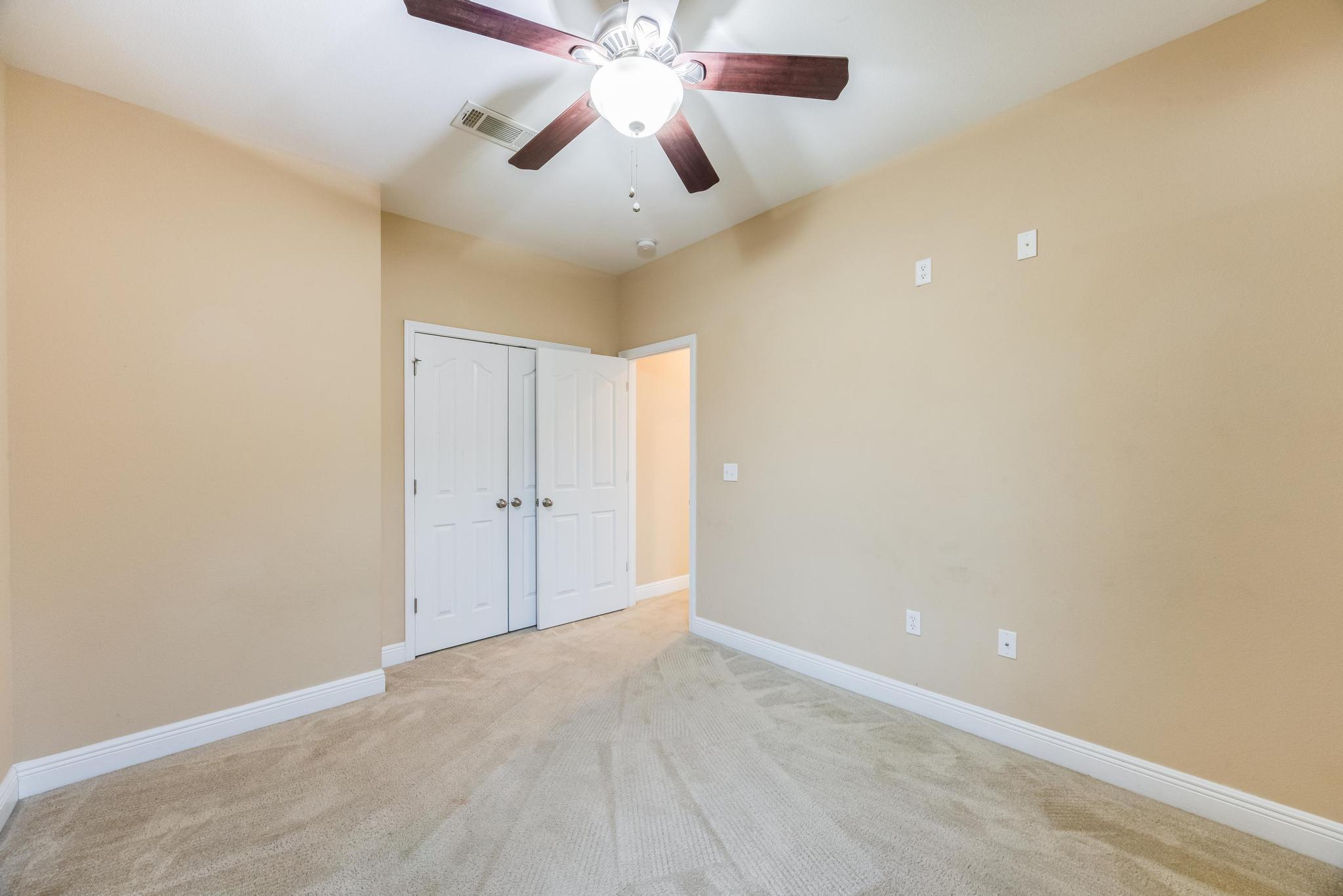 750 Lime Lane Crestview, FL 32536 - Photo 35 of 51 en empty room with ceiling fan and window