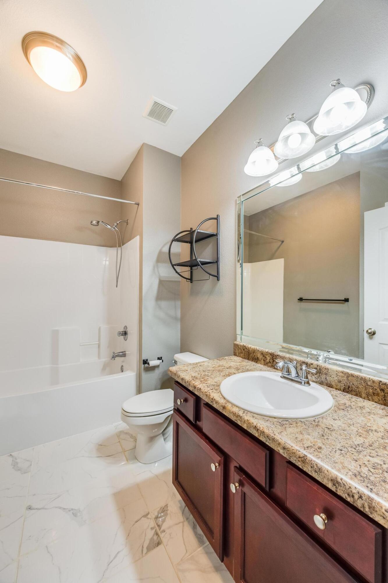750 Lime Lane Crestview, FL 32536 - Photo 36 of 51 a bathroom with a granite countertop double vanity sink and a mirror