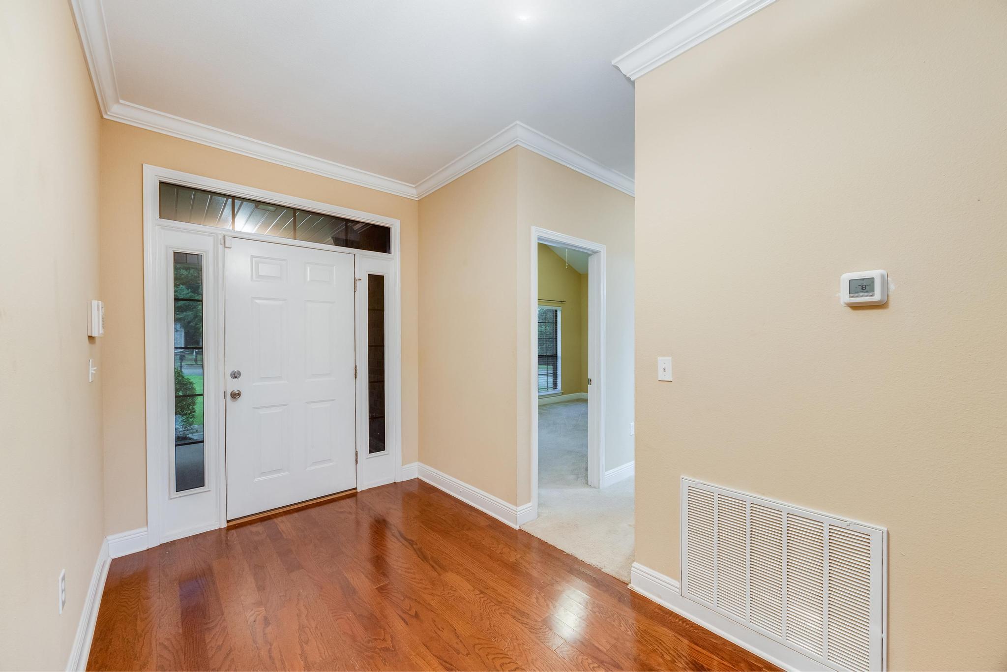 750 Lime Lane Crestview, FL 32536 - Photo 4 of 51 a bedroom with a bed and a table