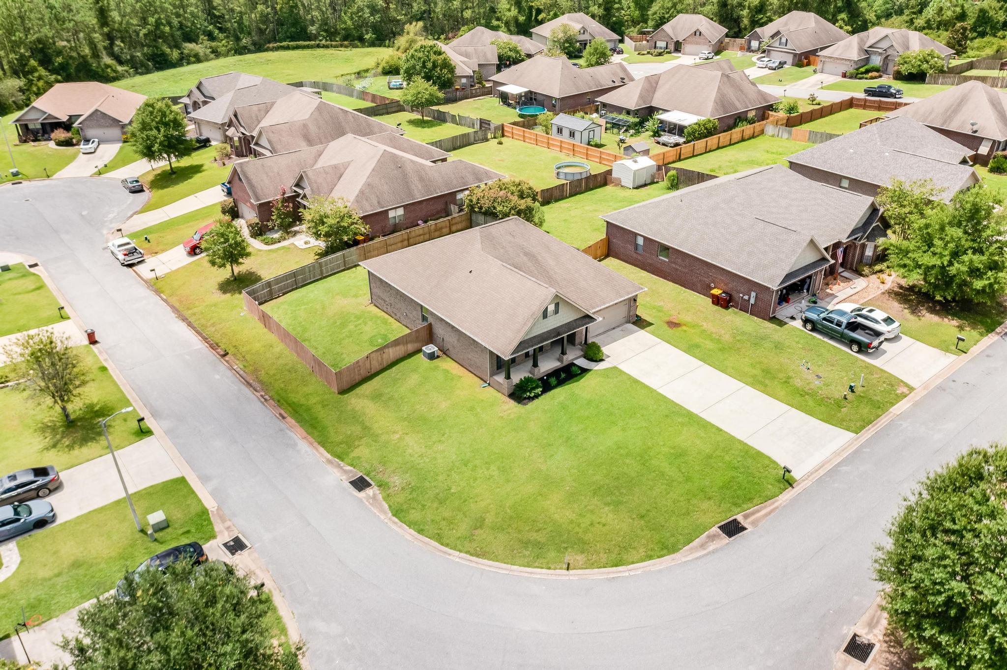 750 Lime Lane Crestview, FL 32536 - Photo 46 of 51 an aerial view of a house with swimming pool and outdoor seating