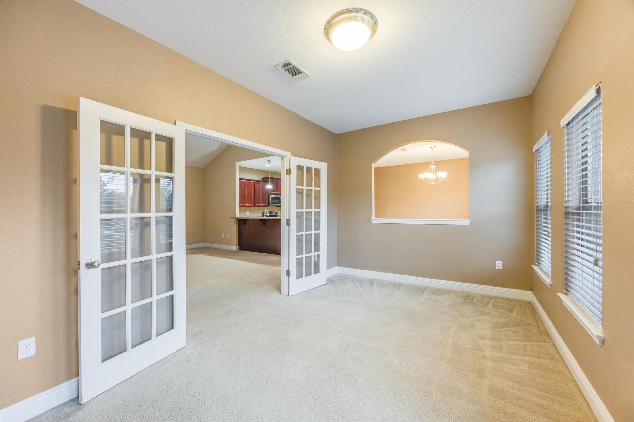 750 Lime Lane Crestview, FL 32536 - Photo 8 of 51 an empty room with windows