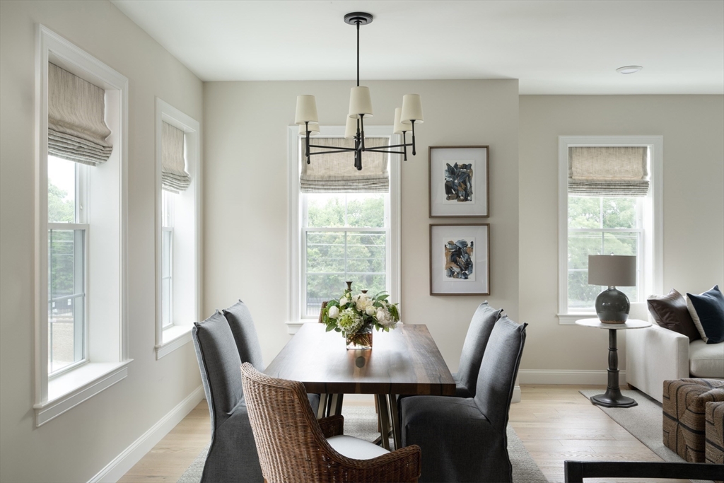 7 Oxbow Road, Unit 51 Raynham, MA 02767 - Photo 11 of 40 a view of a dining room with furniture window and outside view