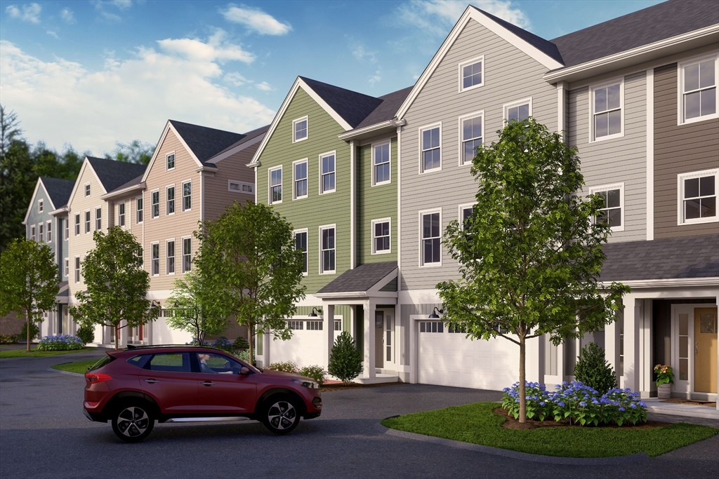 7 Oxbow Road, Unit 51 Raynham, MA 02767 - Photo 32 of 40 a view of a car parked in front of a brick house