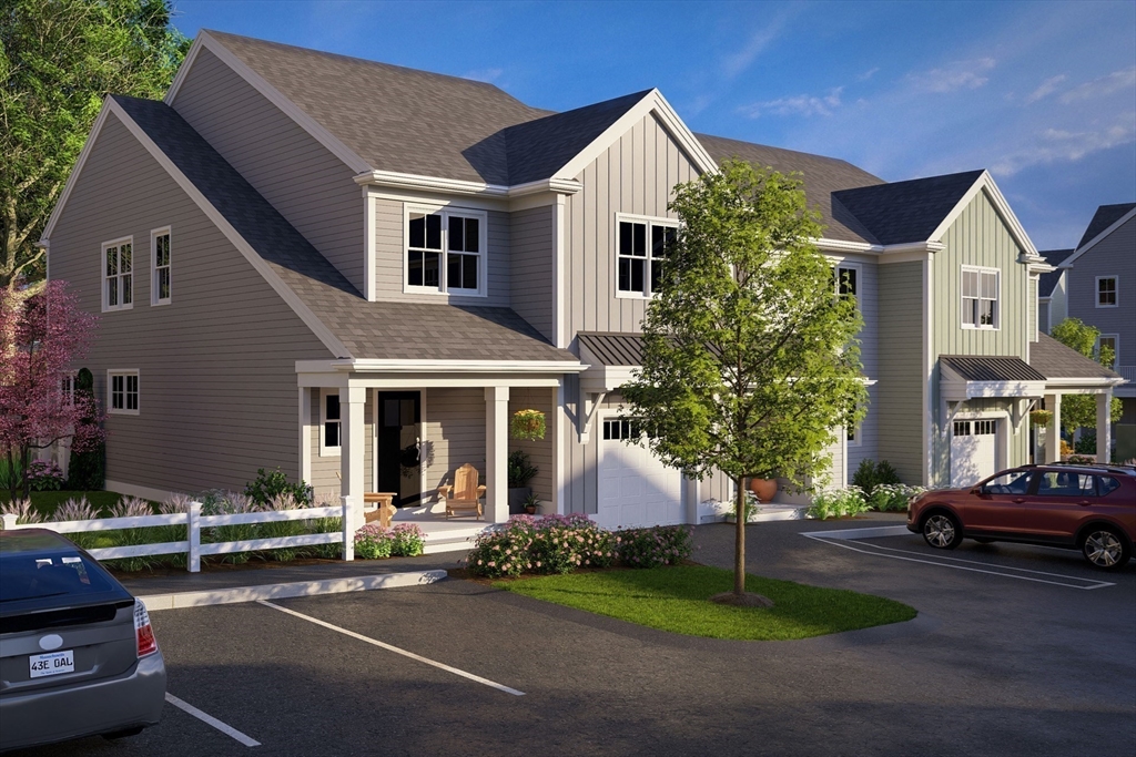 7 Oxbow Road, Unit 51 Raynham, MA 02767 - Photo 4 of 40 a front view of a house with a garden