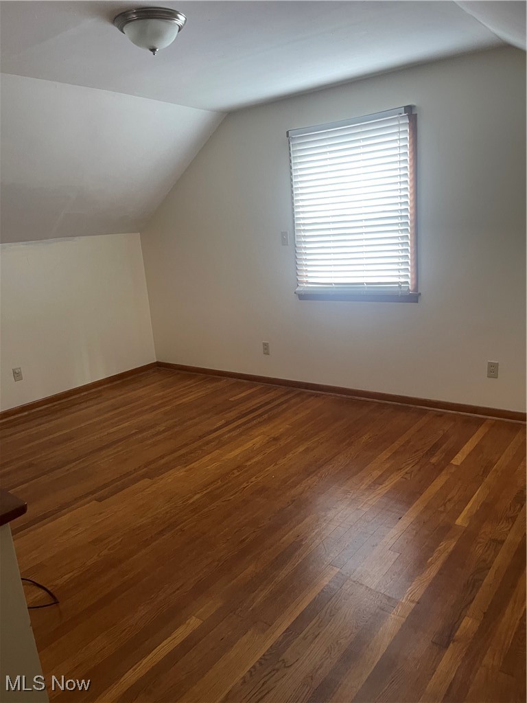1881 17th Street Southwest Akron, OH 44314 - Photo 13 of 20 2nd floor bedroom. Additional living space with lofted ceiling and hardwood / wood-style floors