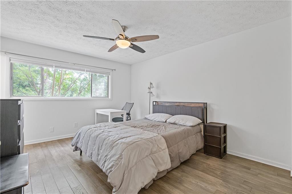 3236 Henderson Mill Road, Unit 1 Chamblee, GA 30341 - Photo 18 of 23 a large bed sitting in a bedroom next to a window