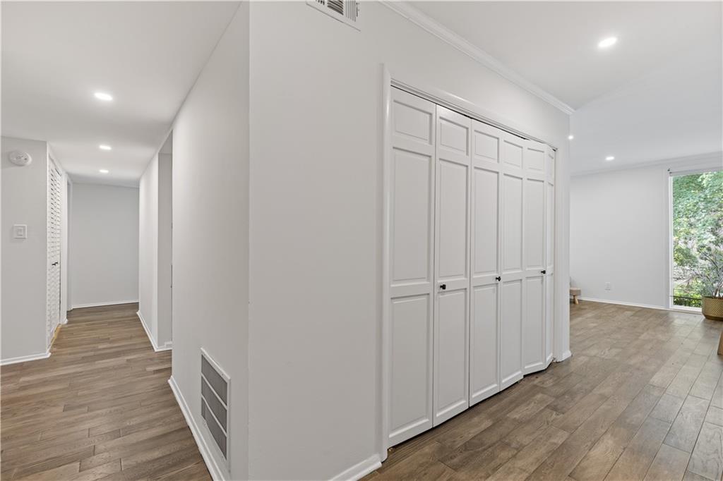 3236 Henderson Mill Road, Unit 1 Chamblee, GA 30341 - Photo 5 of 23 a view of a hallway with wooden floor