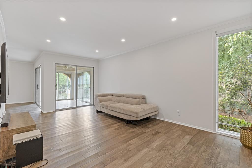 3236 Henderson Mill Road, Unit 1 Chamblee, GA 30341 - Photo 8 of 23 a view of an empty room and wooden floor