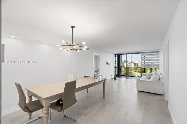 a view of a livingroom with furniture and chandelier