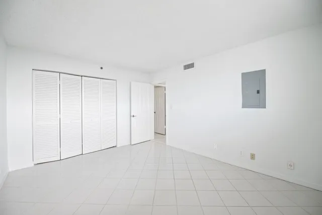 an empty room with white walls