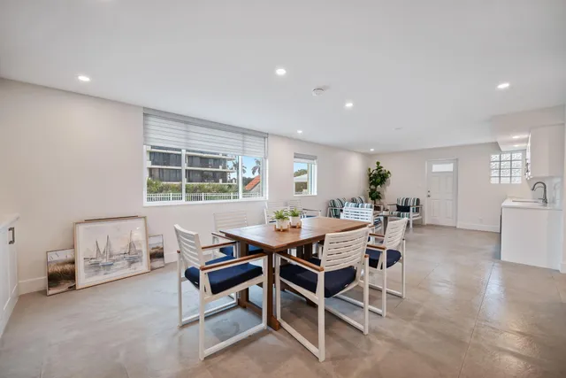 a dining room with a table and chairs