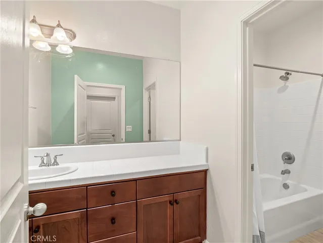 a bathroom with a bathtub and a sink