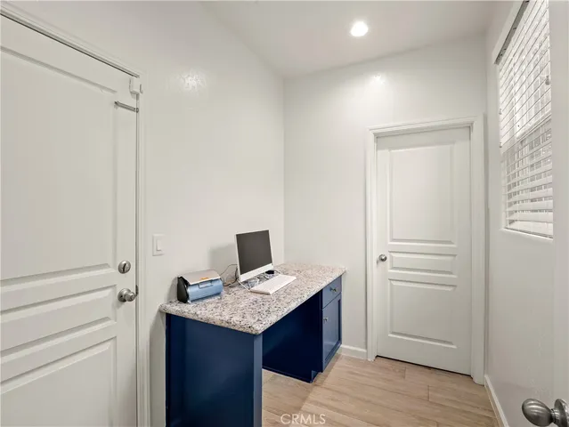 a view of kitchen with furniture and wooden floor