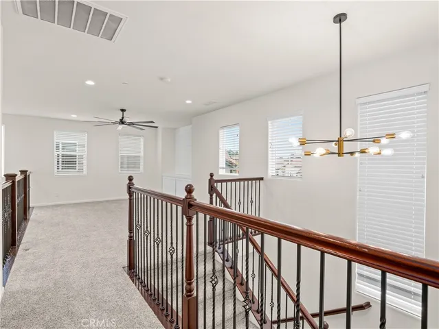 a view of a hallway with windows