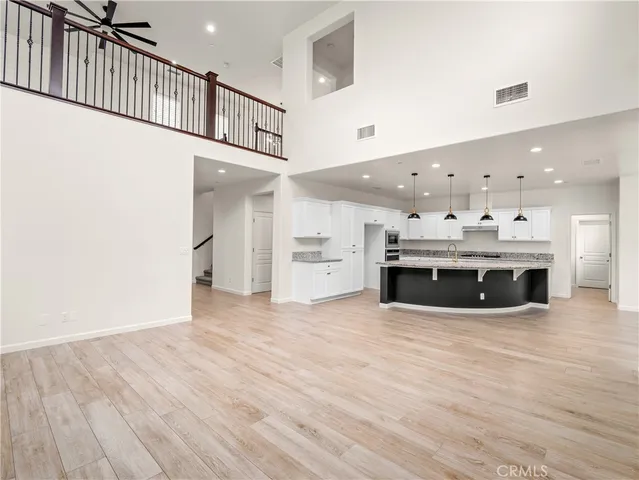 a view of kitchen with furniture and wooden floor