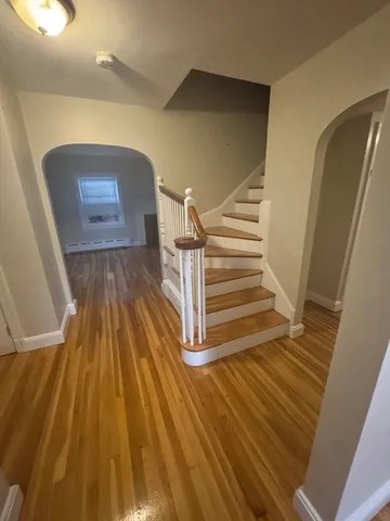 a view of entryway with wooden floor