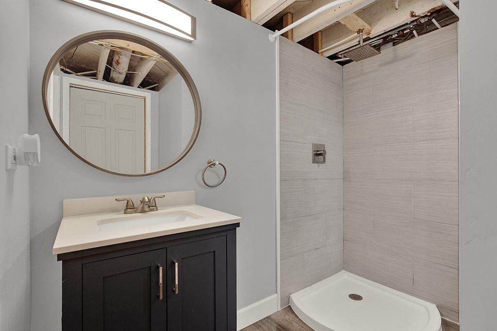 1034 McCoy Road McKees Rocks, PA 15136 - Photo 18 of 22 a bathroom with a sink a toilet and shower