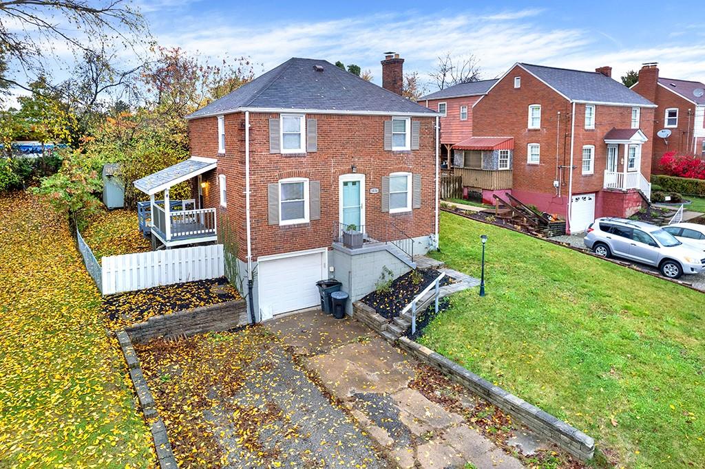 1034 McCoy Road McKees Rocks, PA 15136 - Photo 2 of 22 a front view of a house with a yard