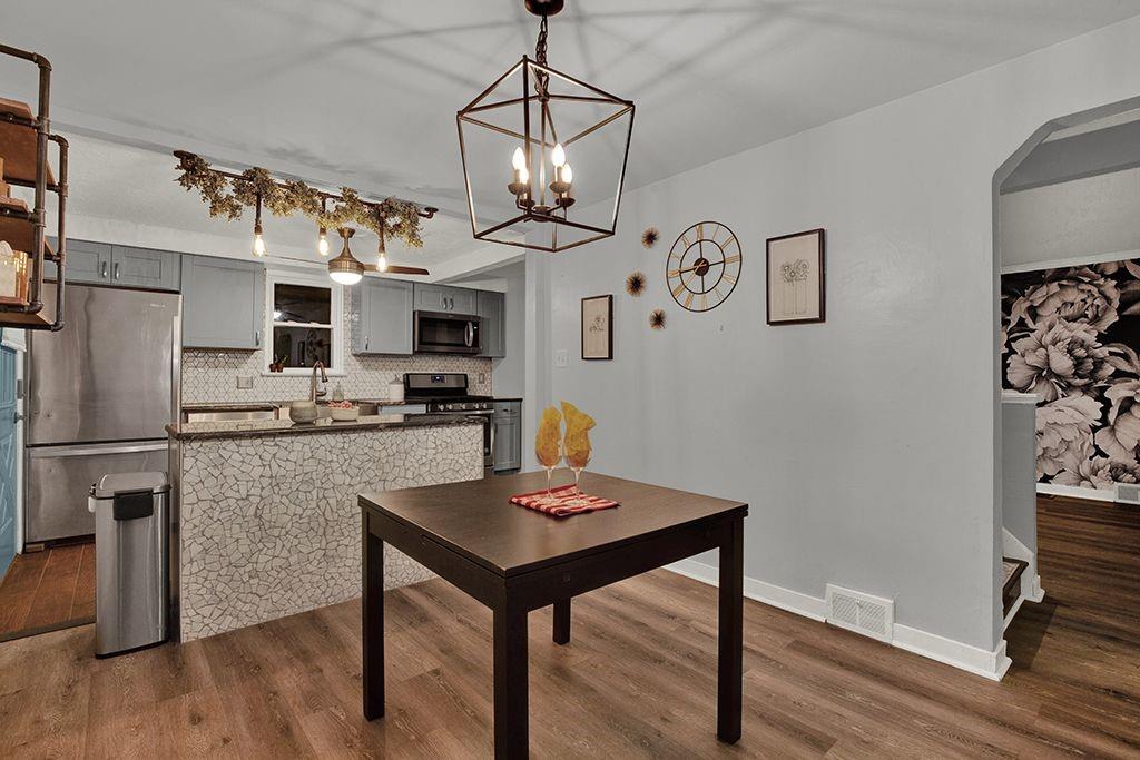 1034 McCoy Road McKees Rocks, PA 15136 - Photo 6 of 22 a kitchen with stainless steel appliances granite countertop a microwave a stove and refrigerator