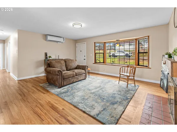 a living room with furniture and a rug