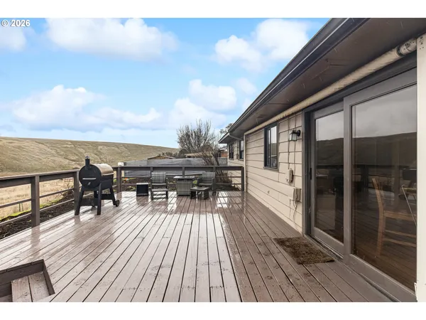a view of roof deck with patio