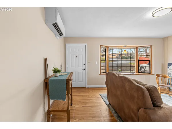 a bedroom with furniture and a window