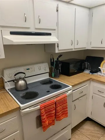 a bedroom with bed and a window