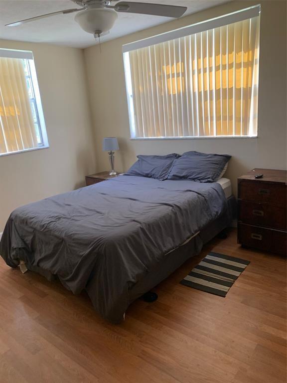 1681 Northwest 70th Avenue, Unit 403 Plantation, FL 33313 - Photo 16 of 54 a bed sitting in a bedroom next to a window