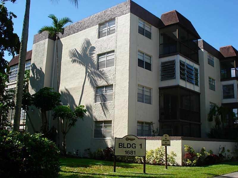 1681 Northwest 70th Avenue, Unit 403 Plantation, FL 33313 - Photo 2 of 54 a view of a building with many windows