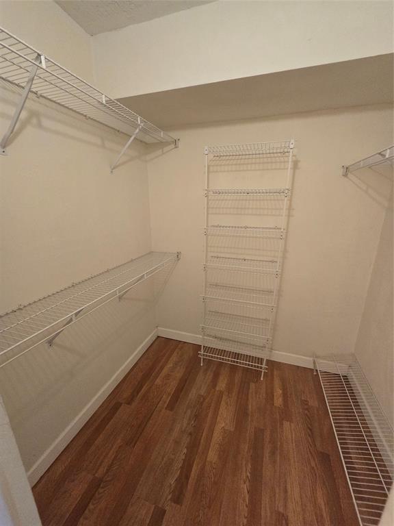 1681 Northwest 70th Avenue, Unit 403 Plantation, FL 33313 - Photo 26 of 54 a view of a room with wooden floor and utility room