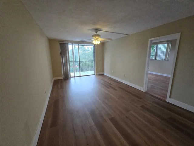 a view of a balcony with a small yard