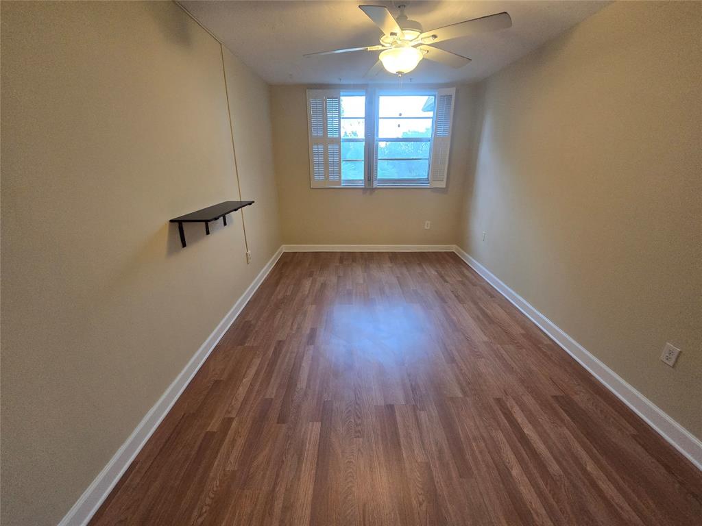 1681 Northwest 70th Avenue, Unit 403 Plantation, FL 33313 - Photo 31 of 54 wooden floor in an empty room with a window